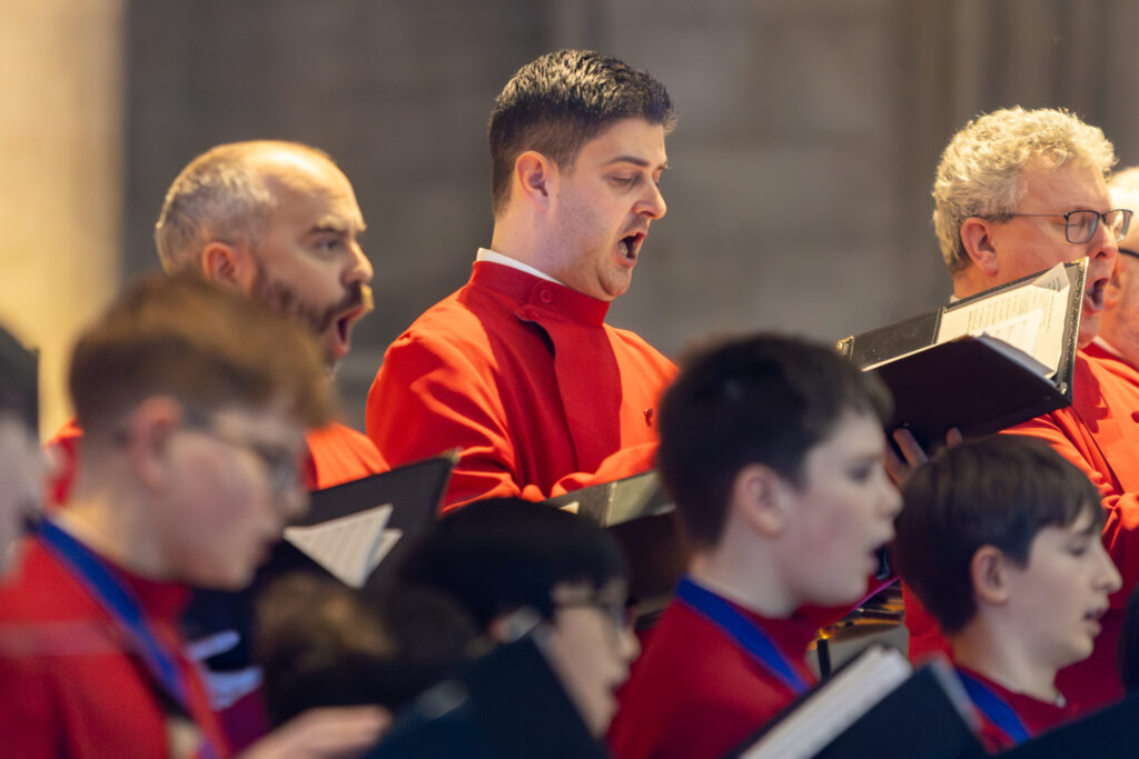 Cathedral choristers singing beneath the Moon. Photo: Toby Shepheard.