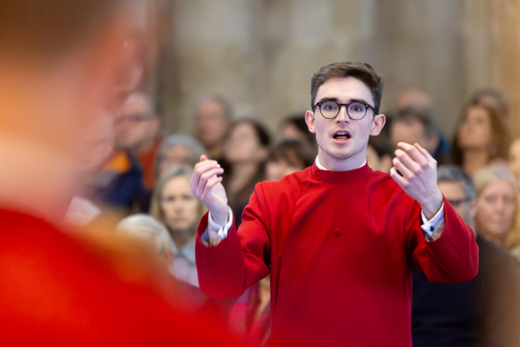 Cathedral choristers singing beneath the Moon. Photo: Toby Shepheard.