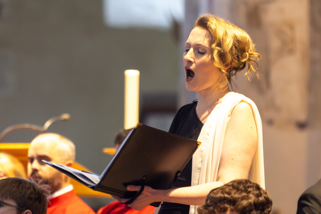 Cathedral choristers singing beneath the Moon. Photo: Toby Shepheard.