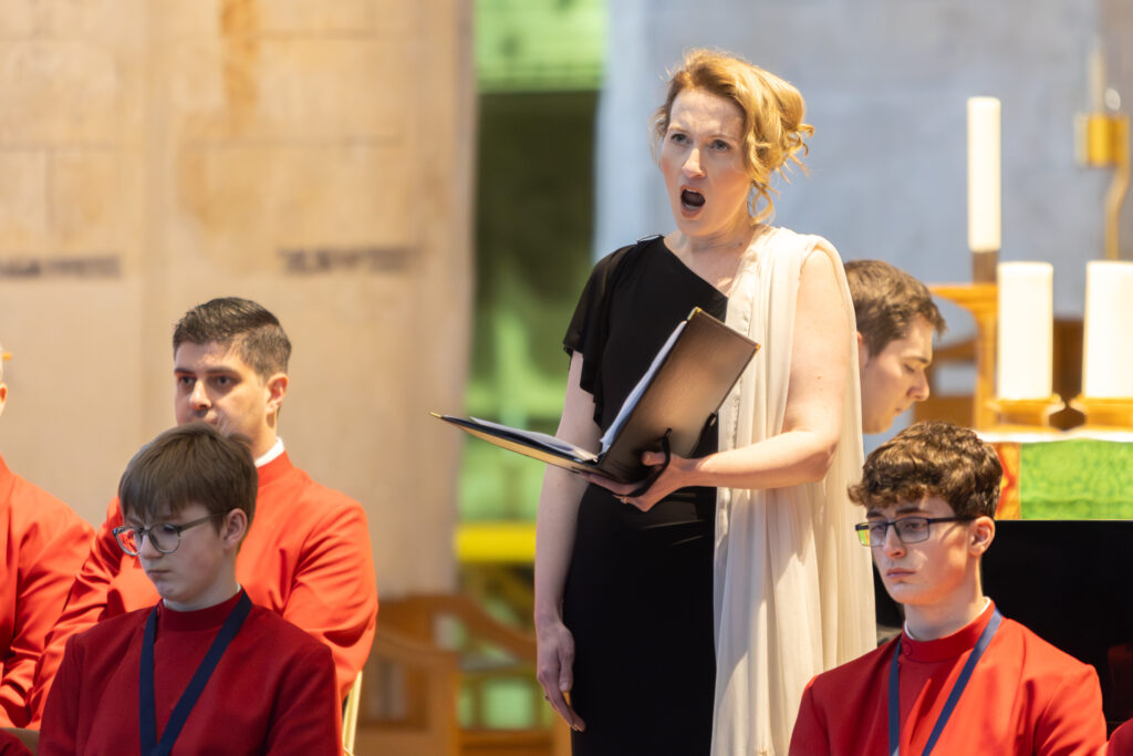 Cathedral choristers singing beneath the Moon. Photo: Toby Shepheard.