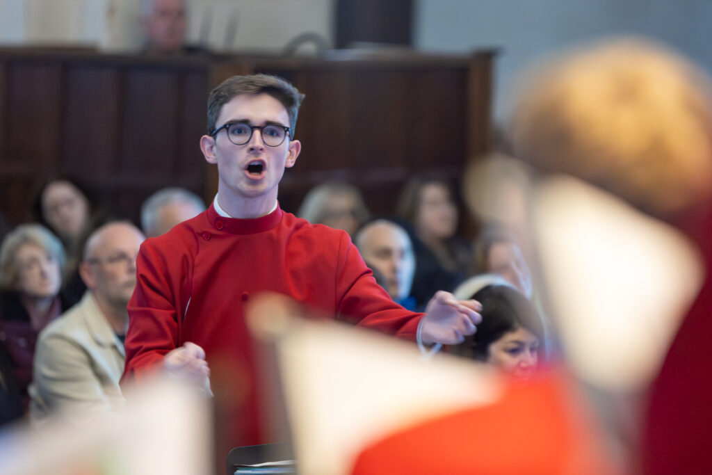 Cathedral choristers singing beneath the Moon. Photo: Toby Shepheard.