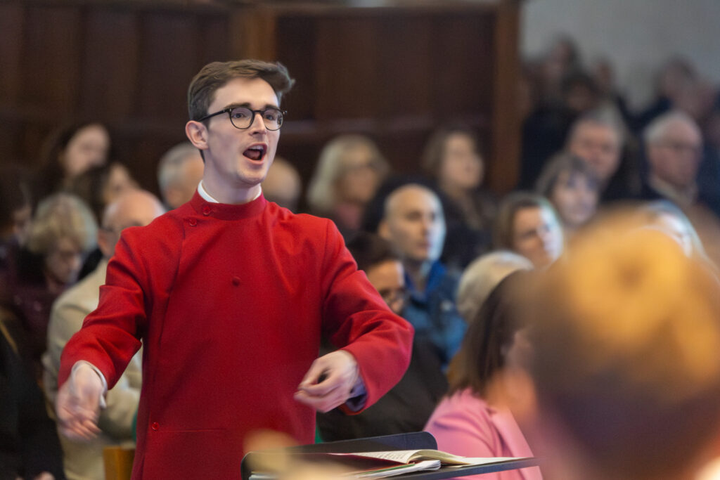 Cathedral choristers singing beneath the Moon. Photo: Toby Shepheard.
