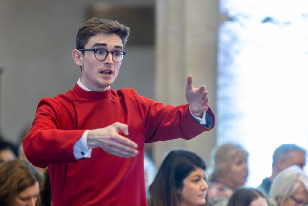 Cathedral choristers singing beneath the Moon. Photo: Toby Shepheard.