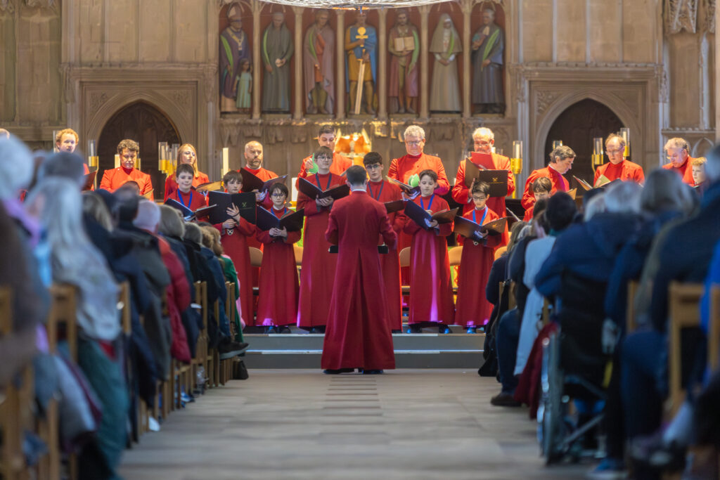 Cathedral choristers singing beneath the Moon. Photo: Toby Shepheard.