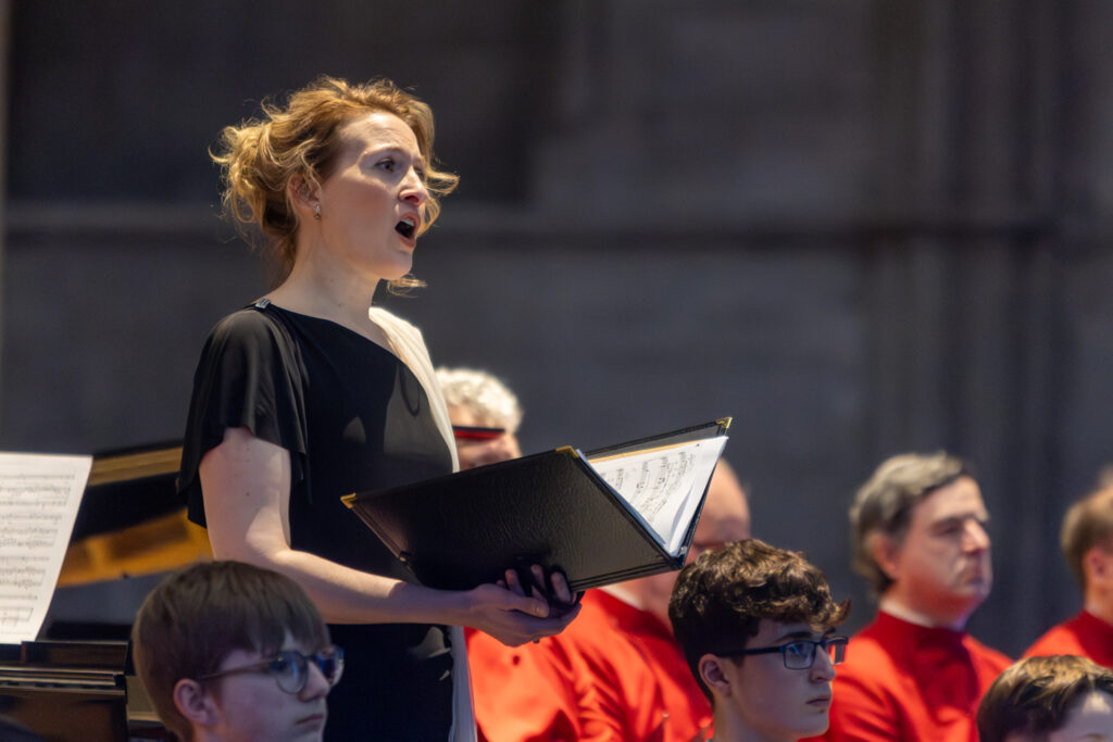 Cathedral choristers singing beneath the Moon. Photo: Toby Shepheard.