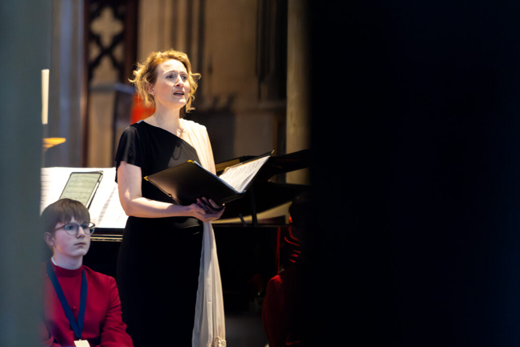 Cathedral choristers singing beneath the Moon. Photo: Toby Shepheard.