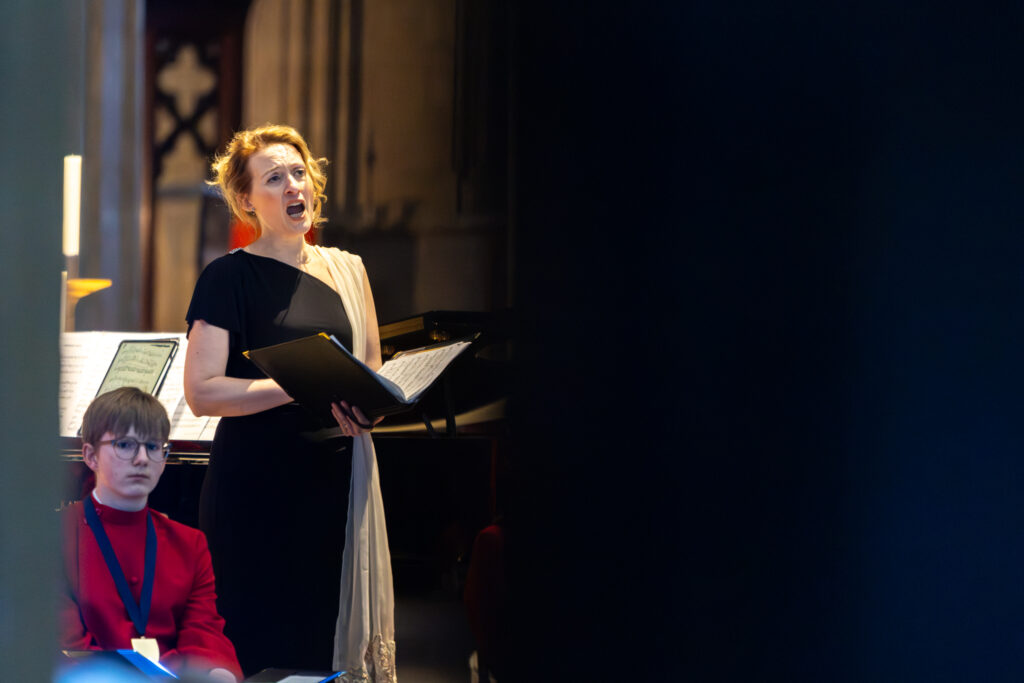 Cathedral choristers singing beneath the Moon. Photo: Toby Shepheard.