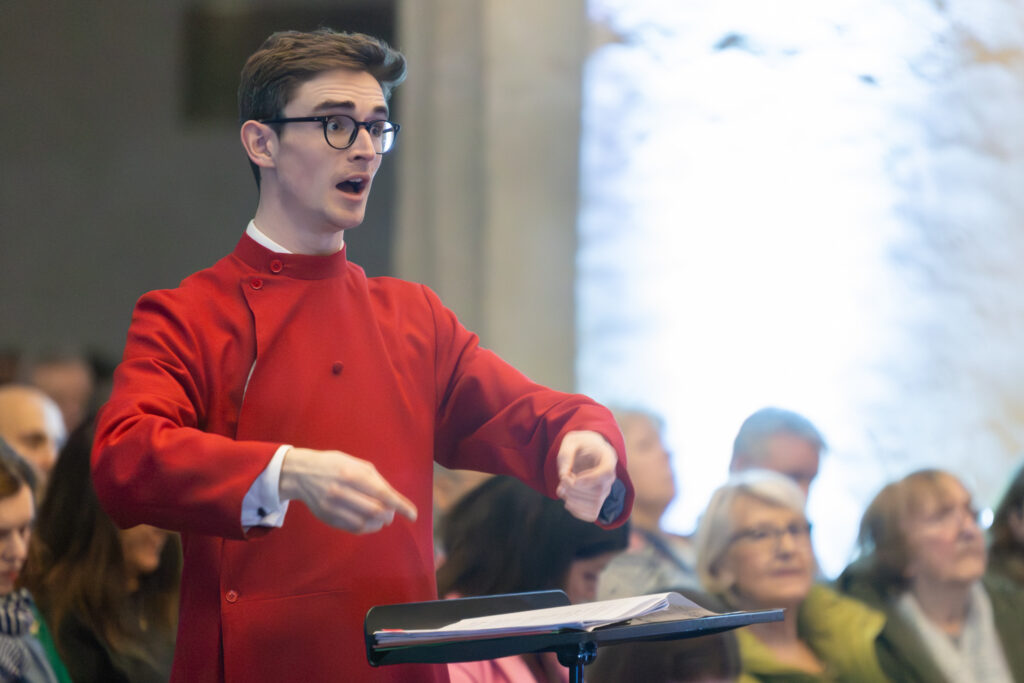 Cathedral choristers singing beneath the Moon. Photo: Toby Shepheard.