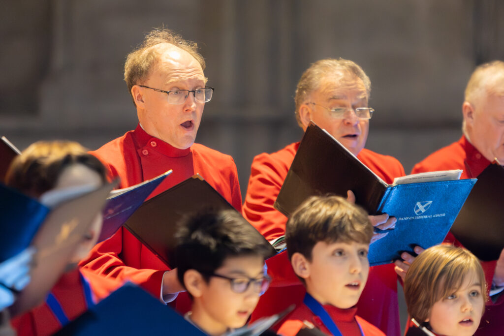 Cathedral choristers singing beneath the Moon. Photo: Toby Shepheard.