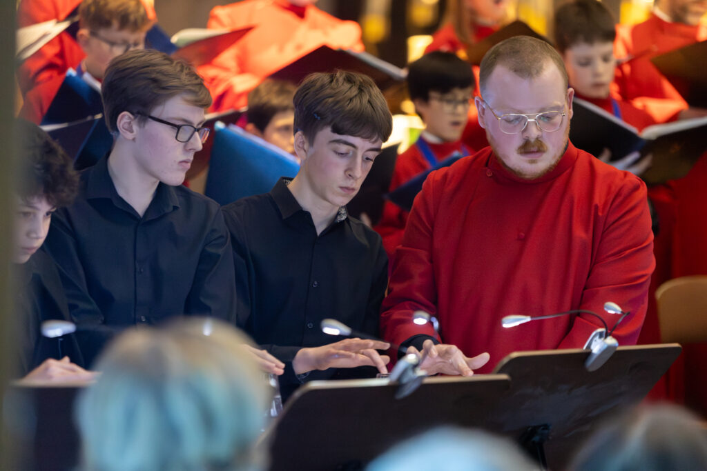 Cathedral choristers singing beneath the Moon. Photo: Toby Shepheard.