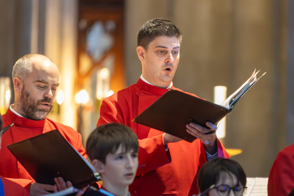 Cathedral choristers singing beneath the Moon. Photo: Toby Shepheard.