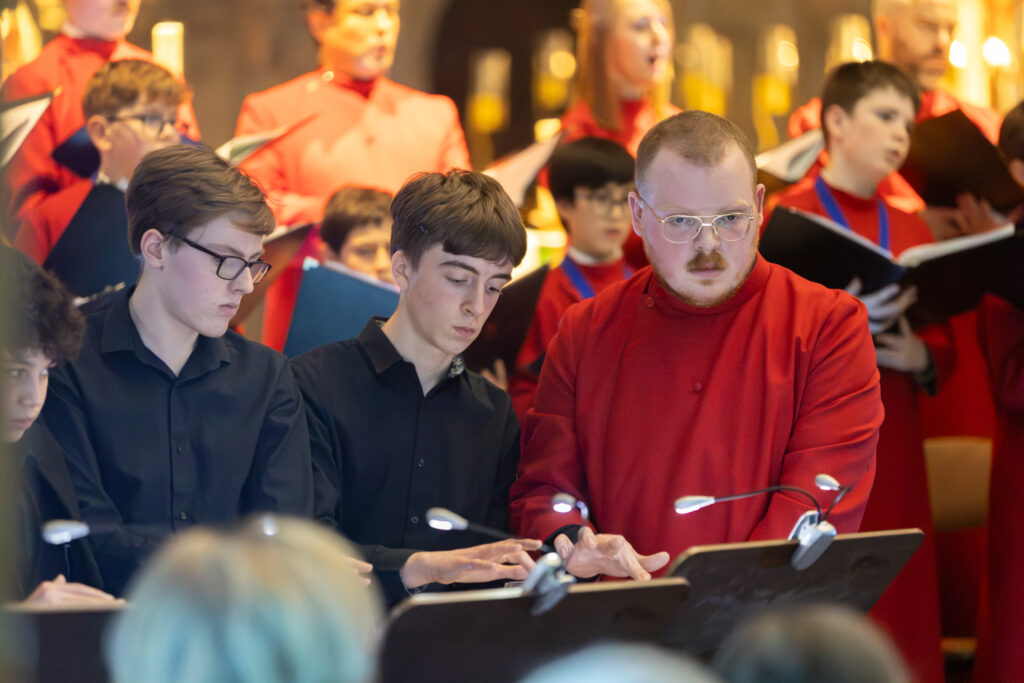 Cathedral choristers singing beneath the Moon. Photo: Toby Shepheard.