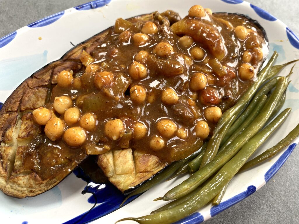 Aubergine halves with leftover tagne
