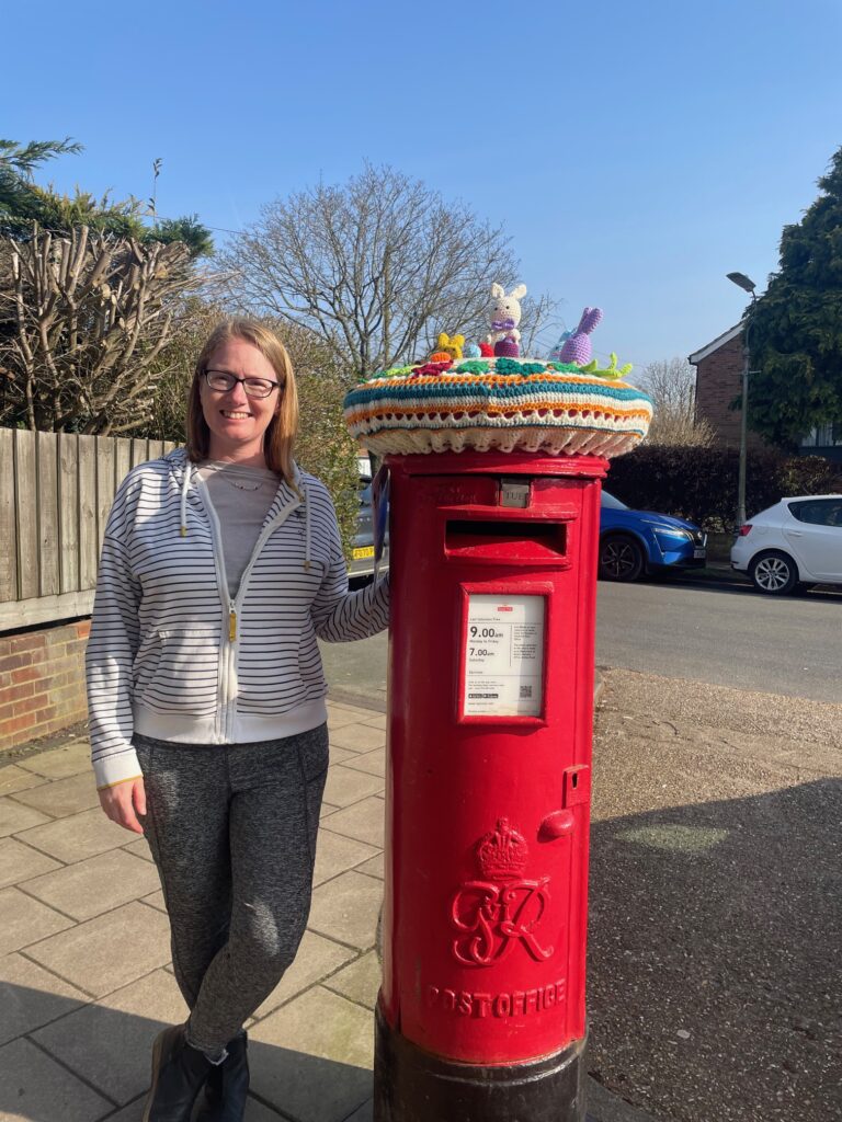 Clare Seldon with her Easter postbox topper in Central Drive.