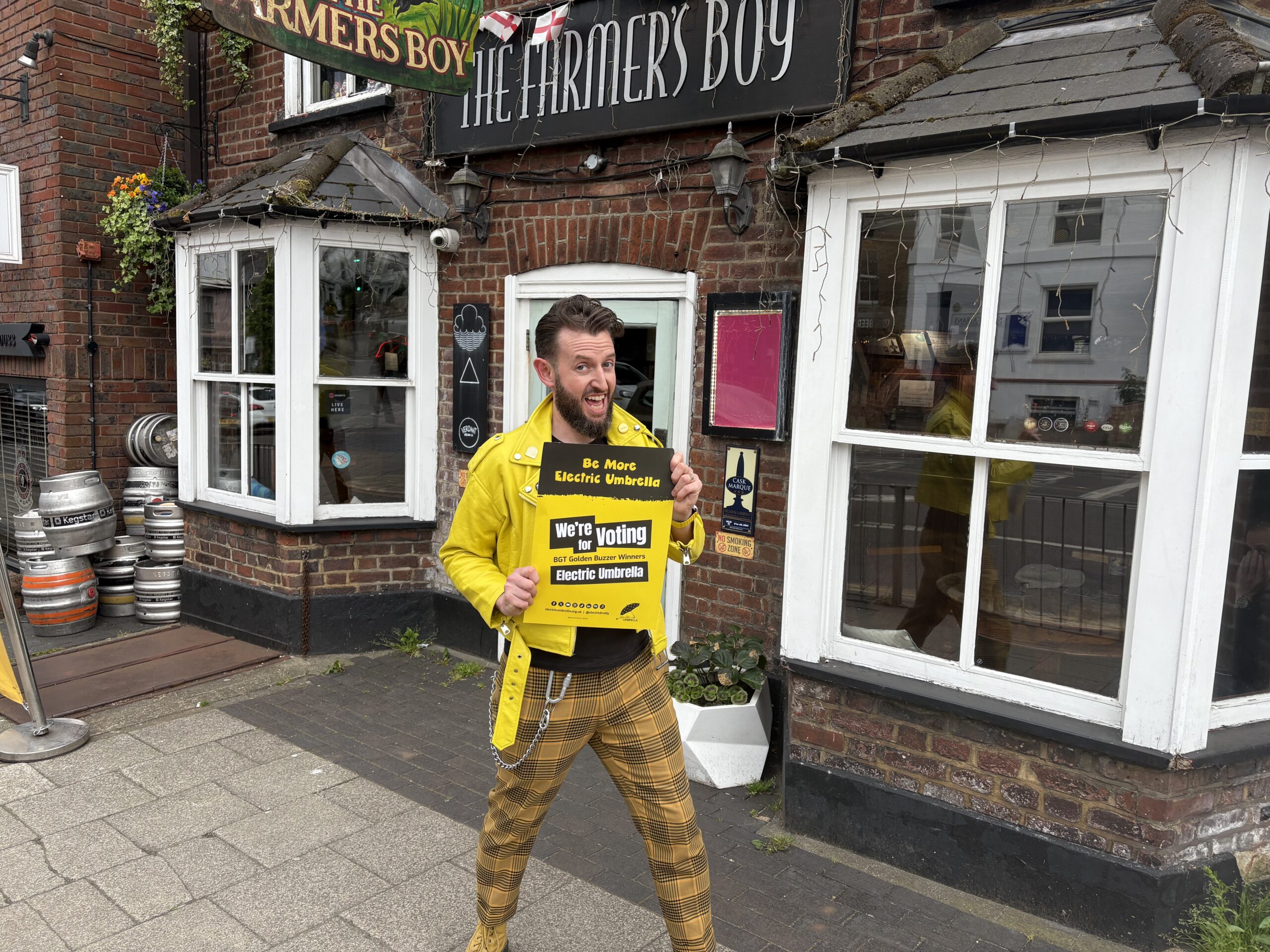 Electric Umbrella's Tommy Waterhart outside The Farmer's Boy pub.