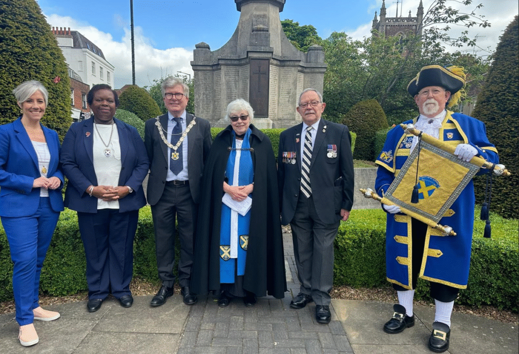 Daisy Cooper, St Albans MP, Cllr Jenni Murray, Deputy Mayor, Cllr Jamie Day, the Mayor, Canon Margaret Tinsley, veteran John Gauthier, and the Town Crier, Stephen Potter