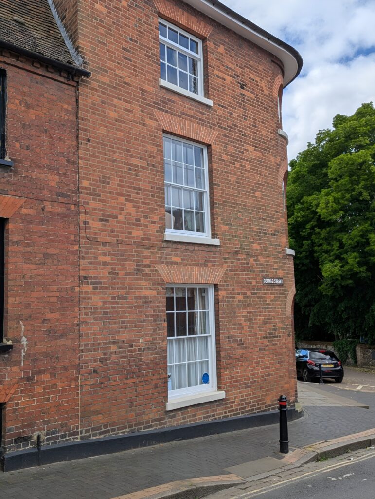 St Albans and District Heritage window sticker in Upcot House at no 16.
