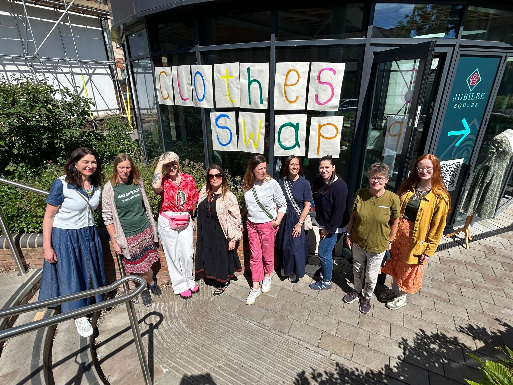 Greenpeace UK volunteers in St Albans organise a free clothes swap event, with the opportunity to raise funds for Greenpeace by donating via a QR code.