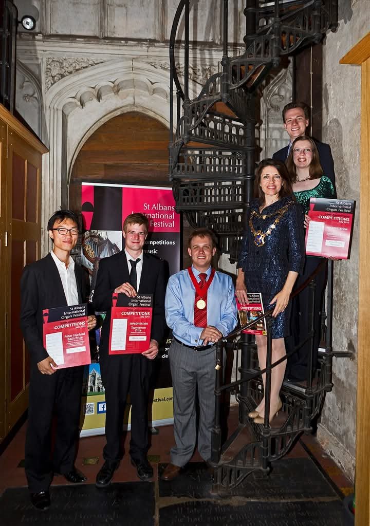 Annie Brewster with the winners from the 2013 Festival on the spiral staircase leading to the Organ Loft in St Albans Cathedral