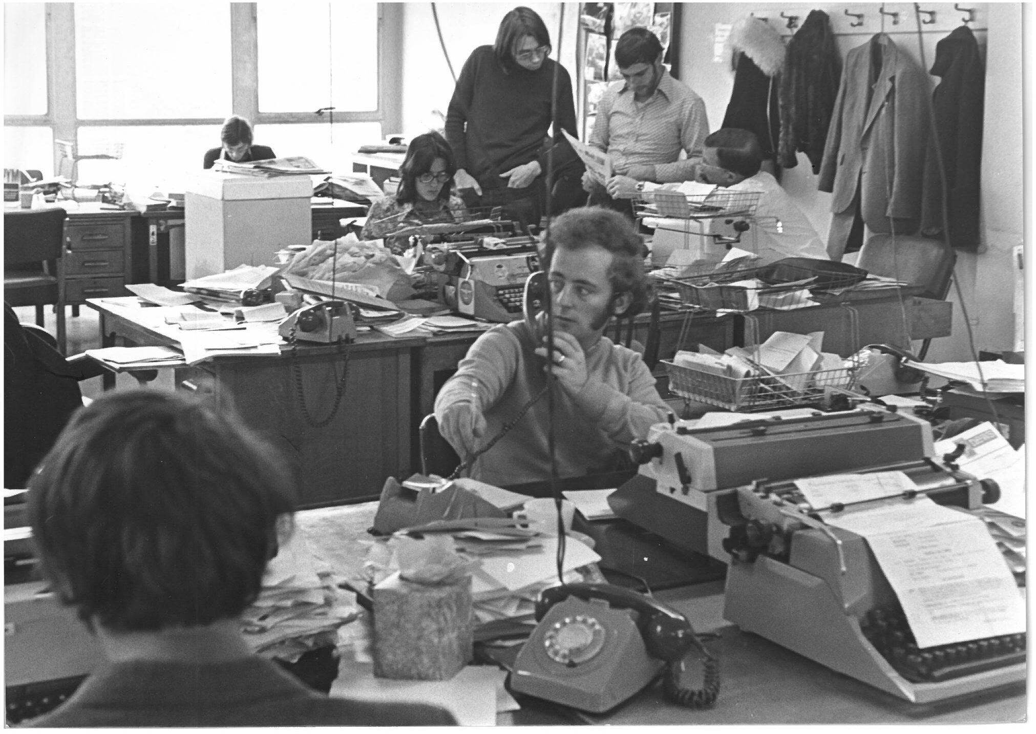 A busy newsroom in the 1980s.