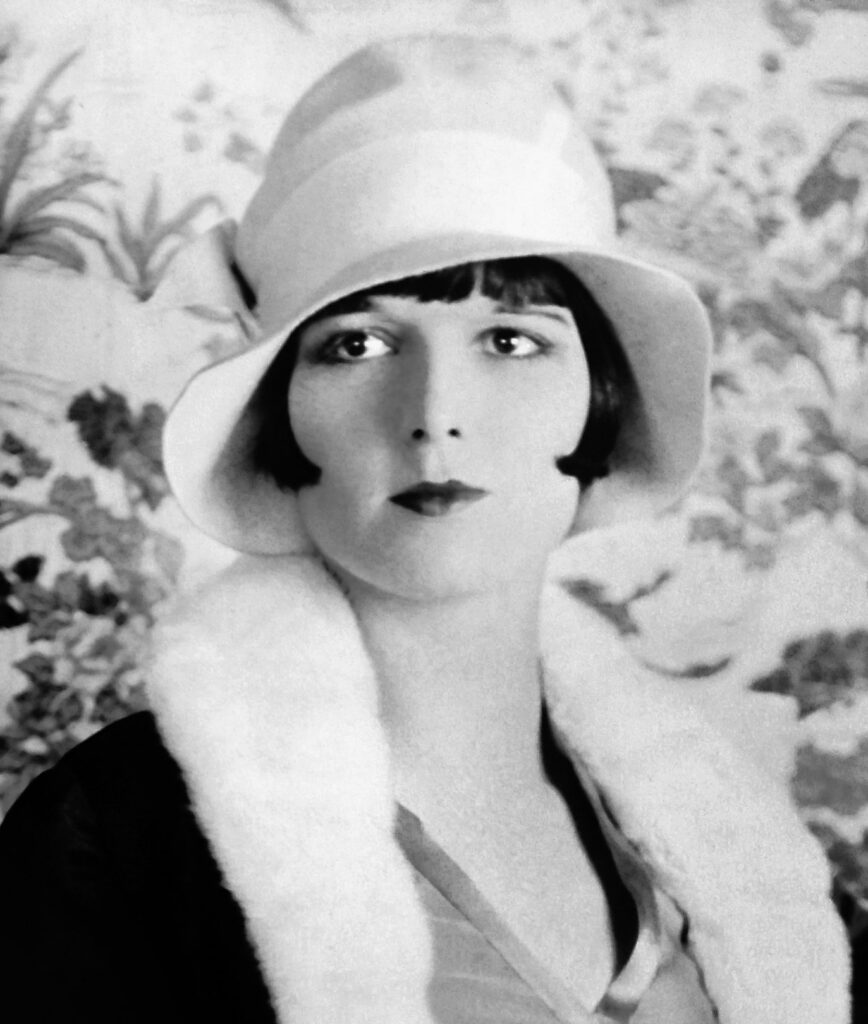 Louise Brooks with bobbed hair under a cloche hat. 1926.