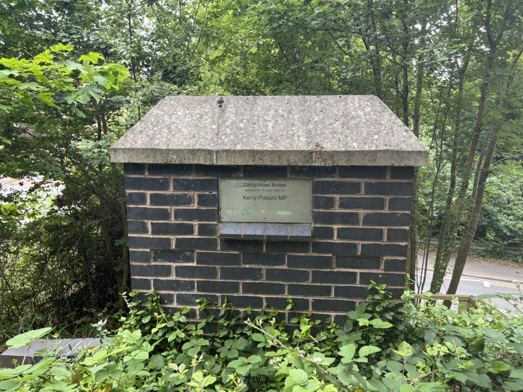 A plaque marking the opening of Camp Road bridge.