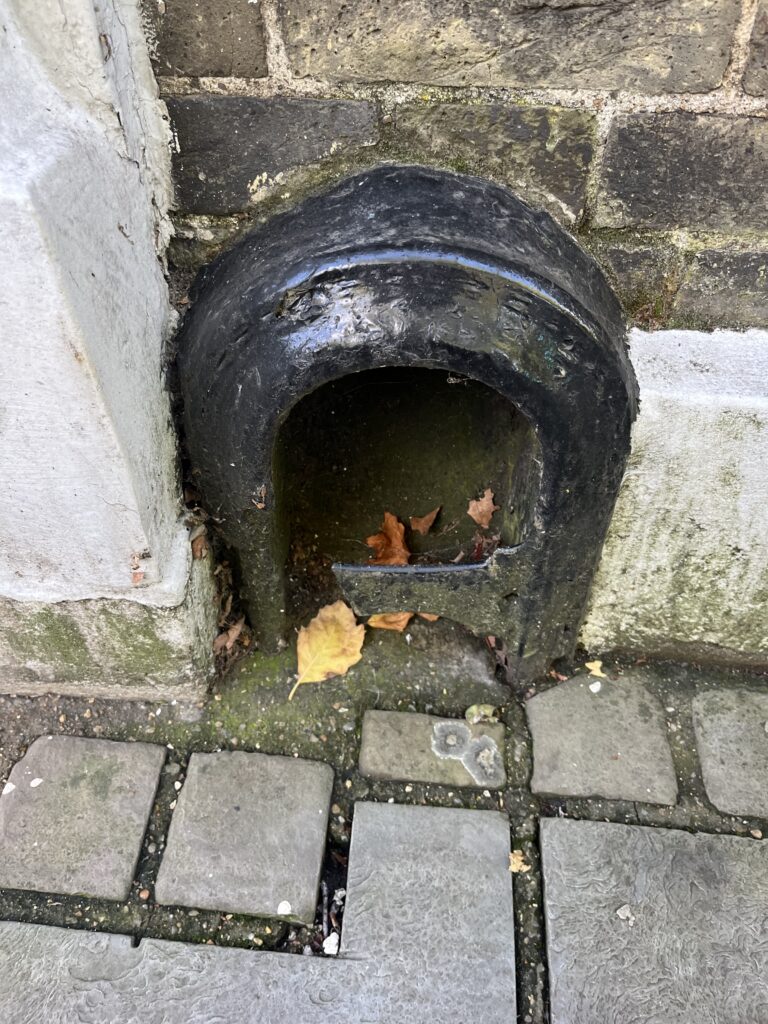 A bootscraper in Victoria Street.