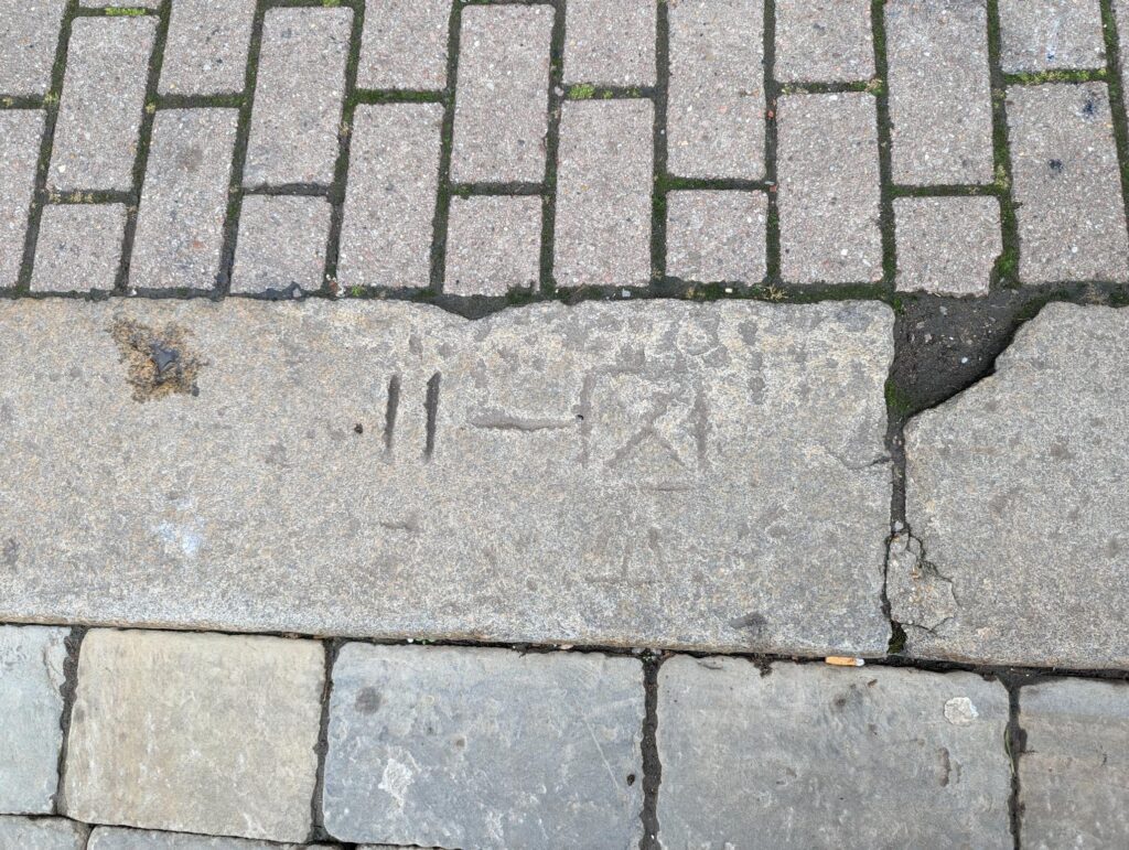 Markings on the street in Market Place.