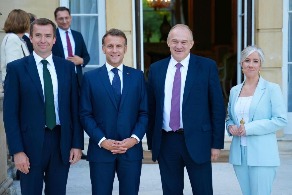 Daisy Cooper with French President Emmanuel Macron