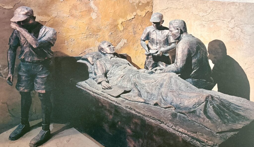 A statue of Hogg on his deathbed in Lanzhou City University, Bailie Campus
