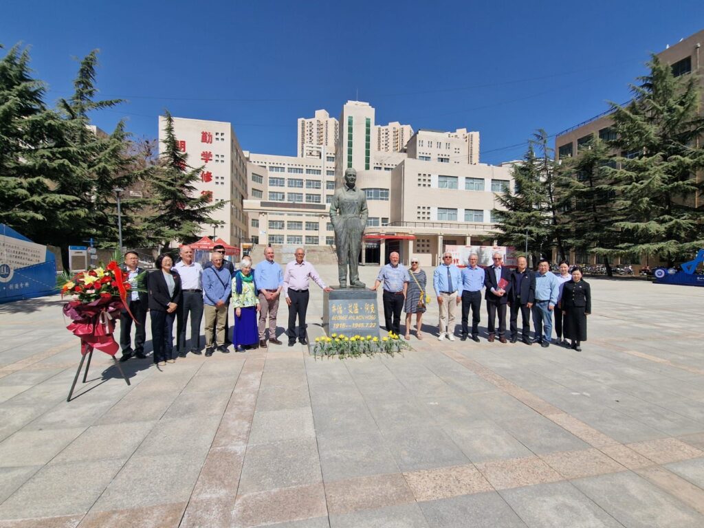 The George Hogg tour party around the memorial to Hogg in Lanzhou in April 2025