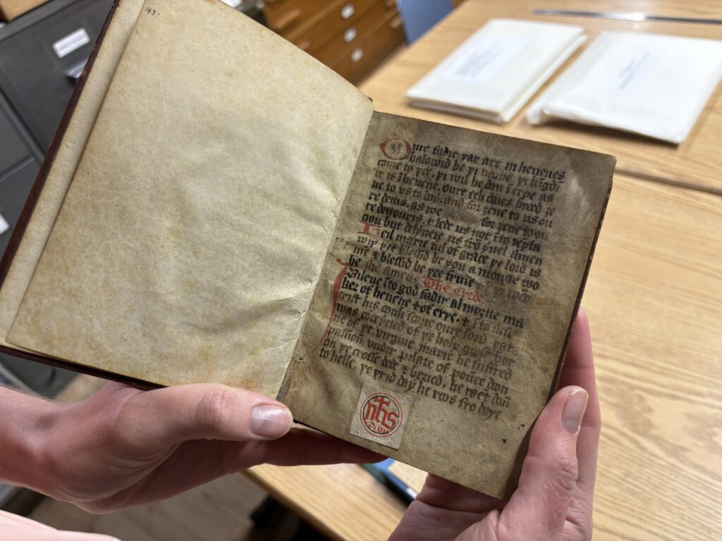 This primer is a manual of religious instruction written in middle English on vellum (calf skin) around 1430. It’s the only manuscript in the archives which the Cathedral believes was in the monastic collection before its dispersal in the reign of Henry VIII which has made it back intact – inexplicably via Russia, where it was rebound in the 18th century. It was originally compiled by William Trebilvile, who had studied Canon Law at Oxford University 1410-1420, and was later gifted back to the Cathedral by Canon Glossop, a member of Cathedral clergy in the 1920s. It includes information recognisable to modern audiences familiar with Christian texts, such as the Creed and the Ten Commandments.
