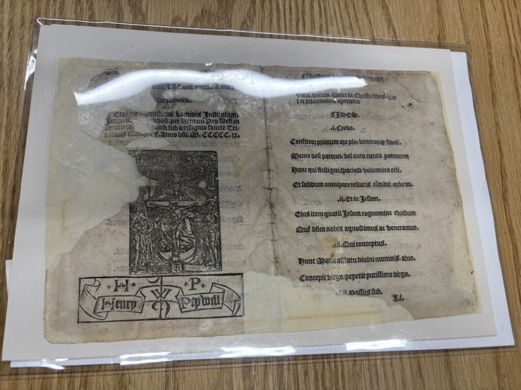 Four pages from a book featuring a poem written in 1520 by an English schoolmaster in St Paul’s.