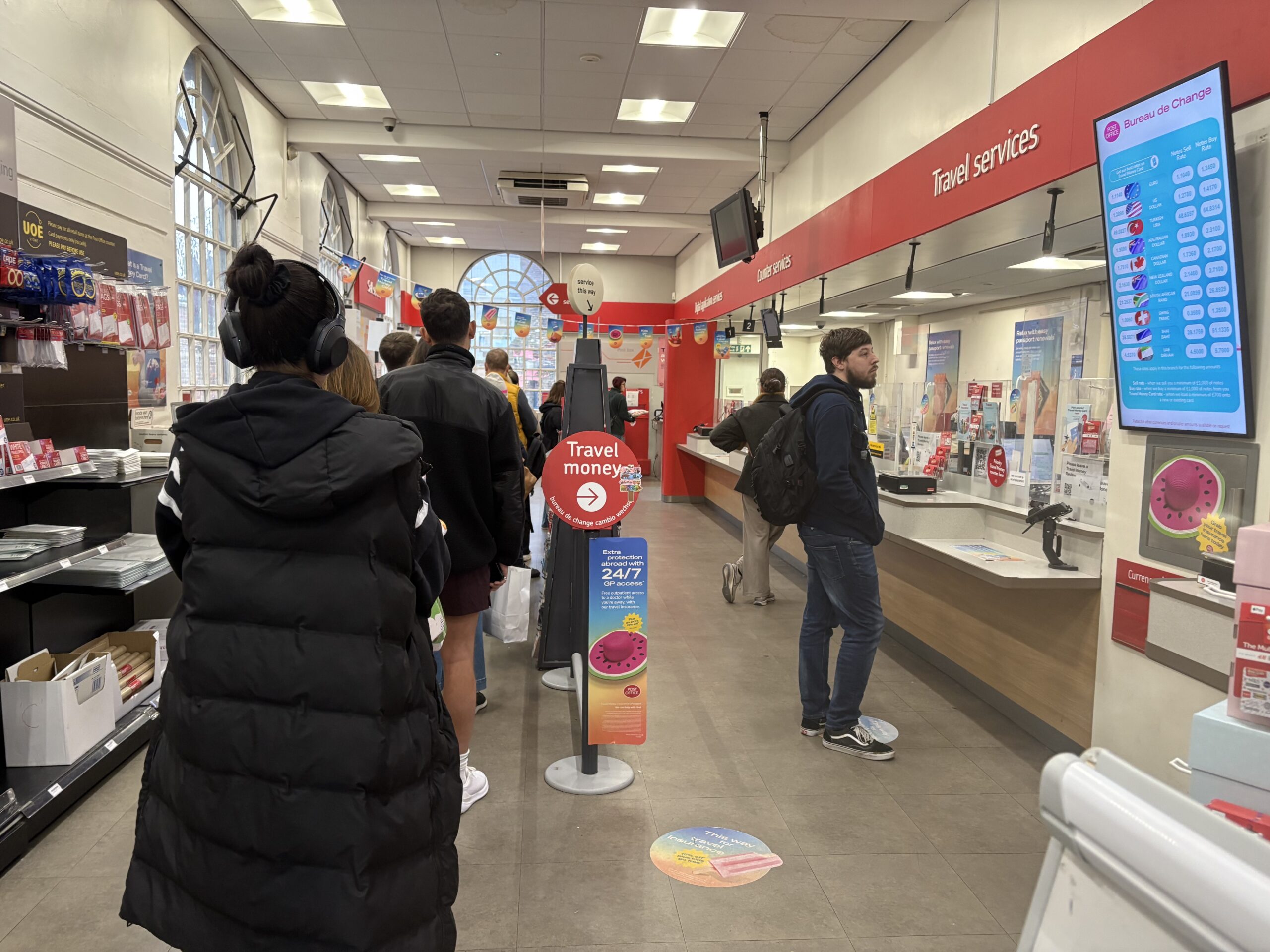 Queueing customers in St Peter's Street Post Office.