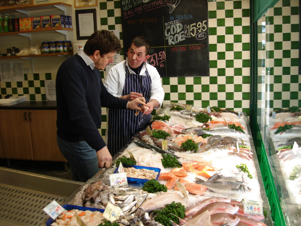 Andrei selecting fish from Stickleback in Welham Green - supplying the restaurant since Day One.