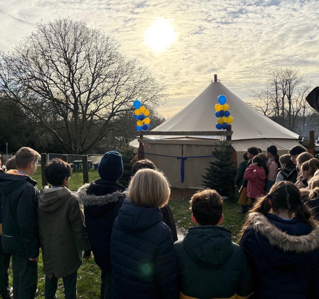 Daisy Cooper opens The Abbey CE VA Primary School's outdoor canopy space.
