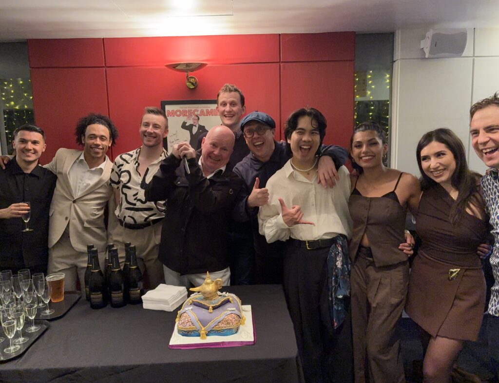 The cast cut an Arena cake after Sunday's performance.