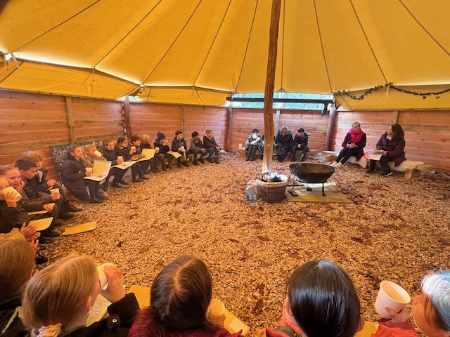 Daisy Cooper inside The Abbey CE VA Primary School's outdoor canopy space.