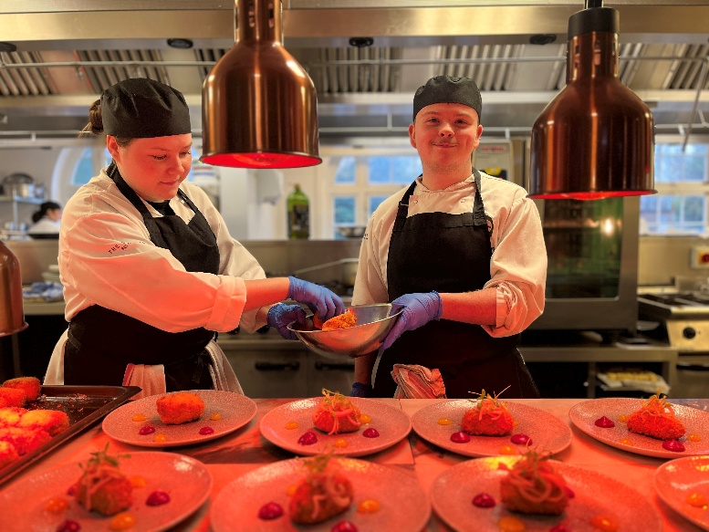 Students working in The Stables restaurant.