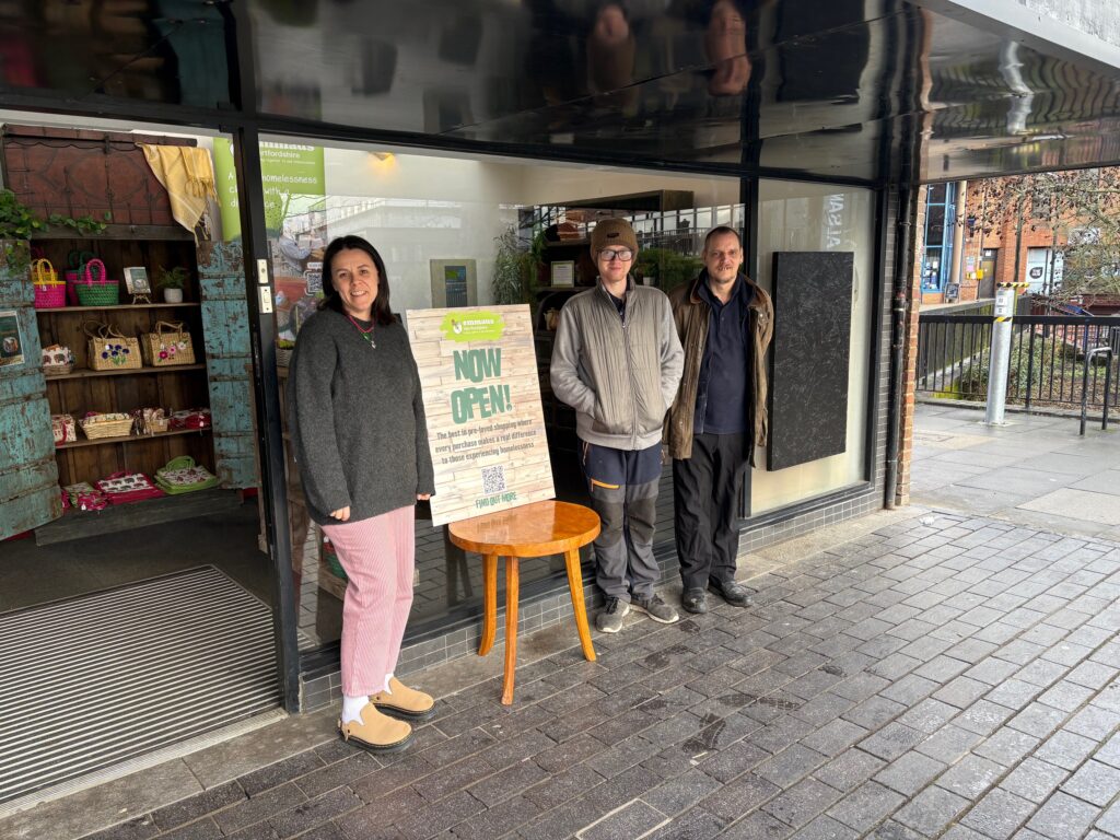 Gemma Beckett and two Emmaus companions outside the new charity shop.