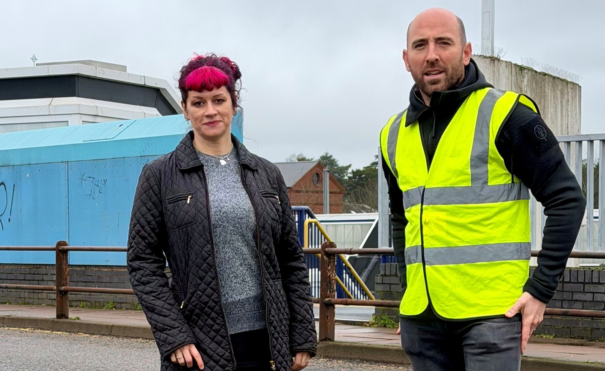 Green Party campaigner Sally Leonard with Cllr Matt Fisher on Victoria Street railway bridge.
