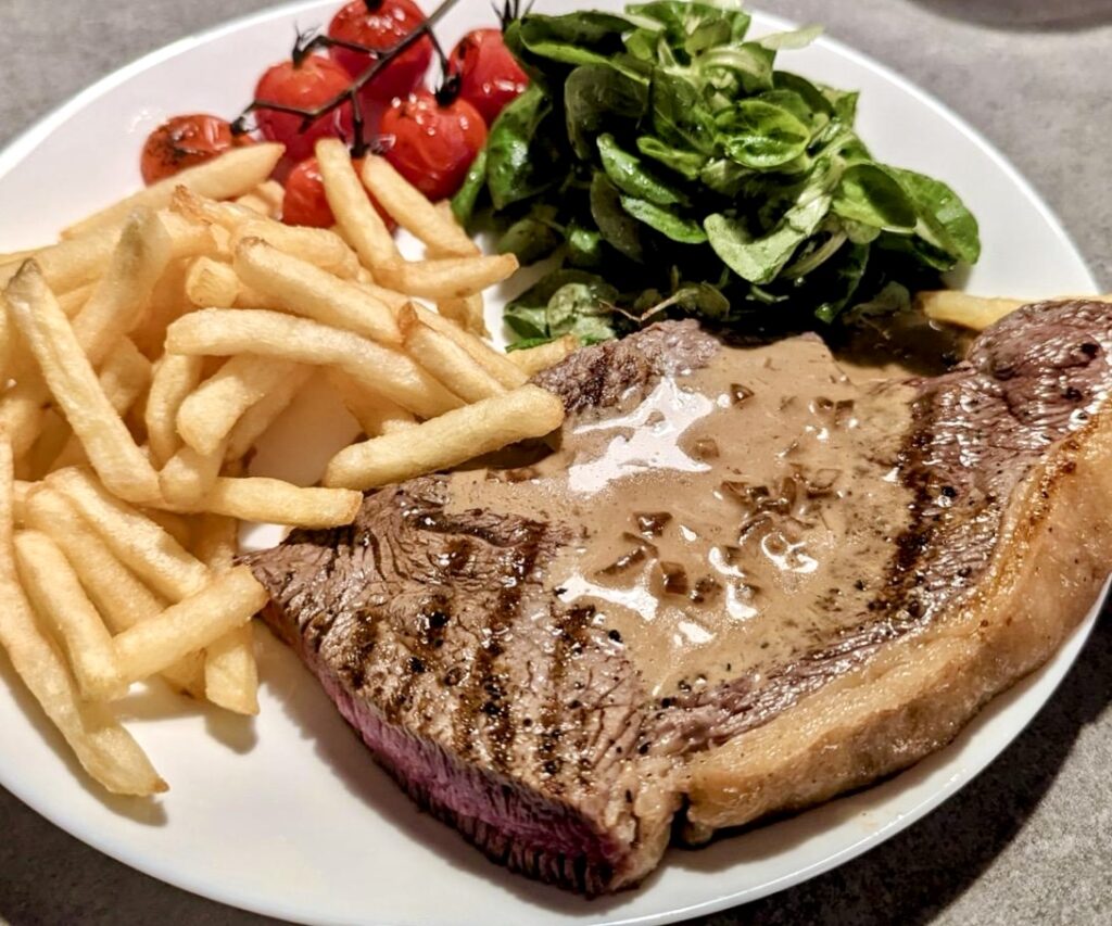 Peppercorn sauce with steak frites