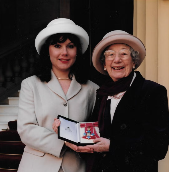 Judy receives her CBE in 1997.