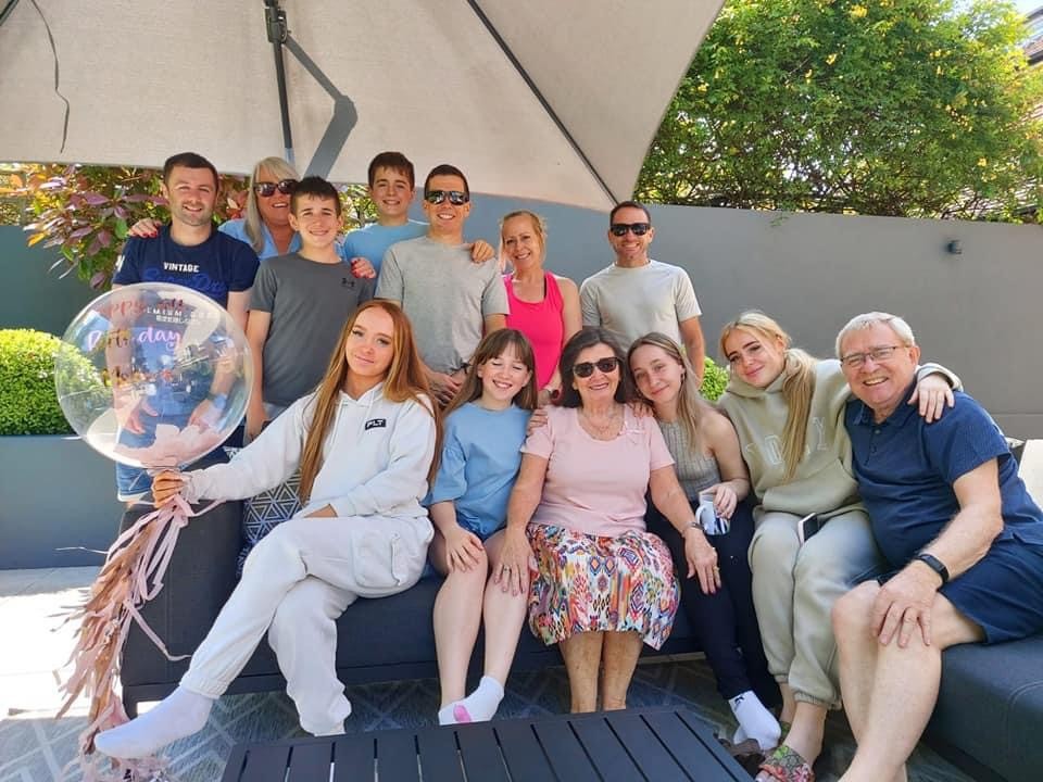 Annette Phillips (front centre) surrounded by her family