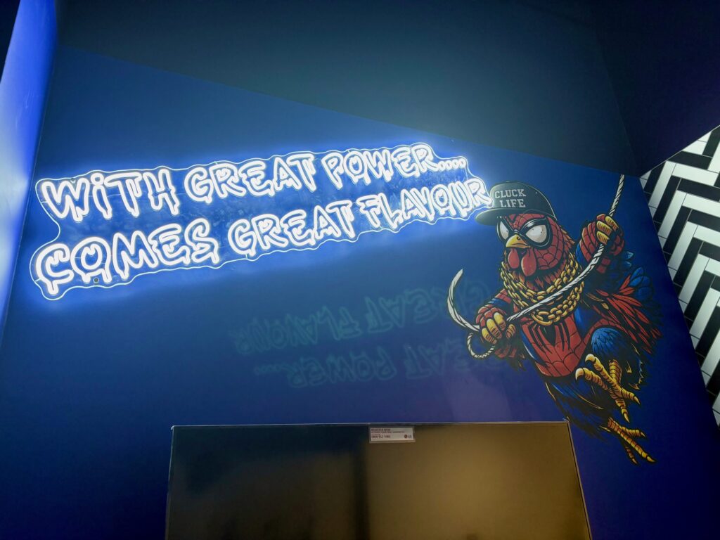One of the illuminated signs inside Chicken George.