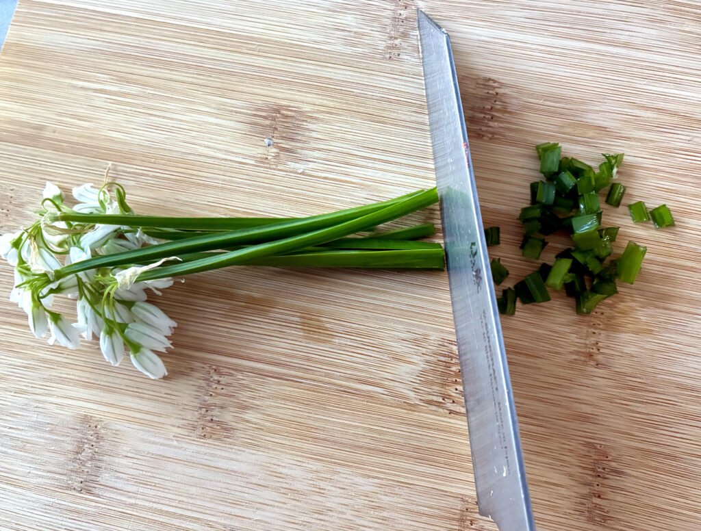 Three-cornered leek on chopping board