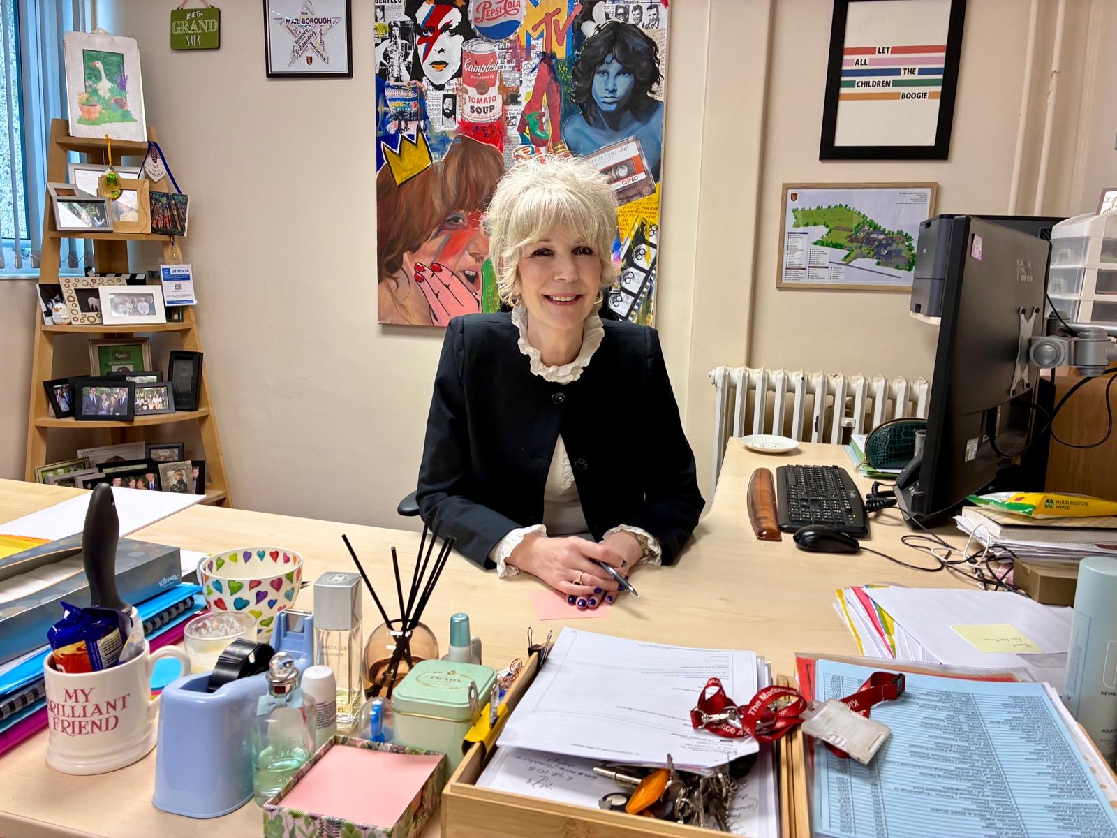 Annie Thomson at her desk
