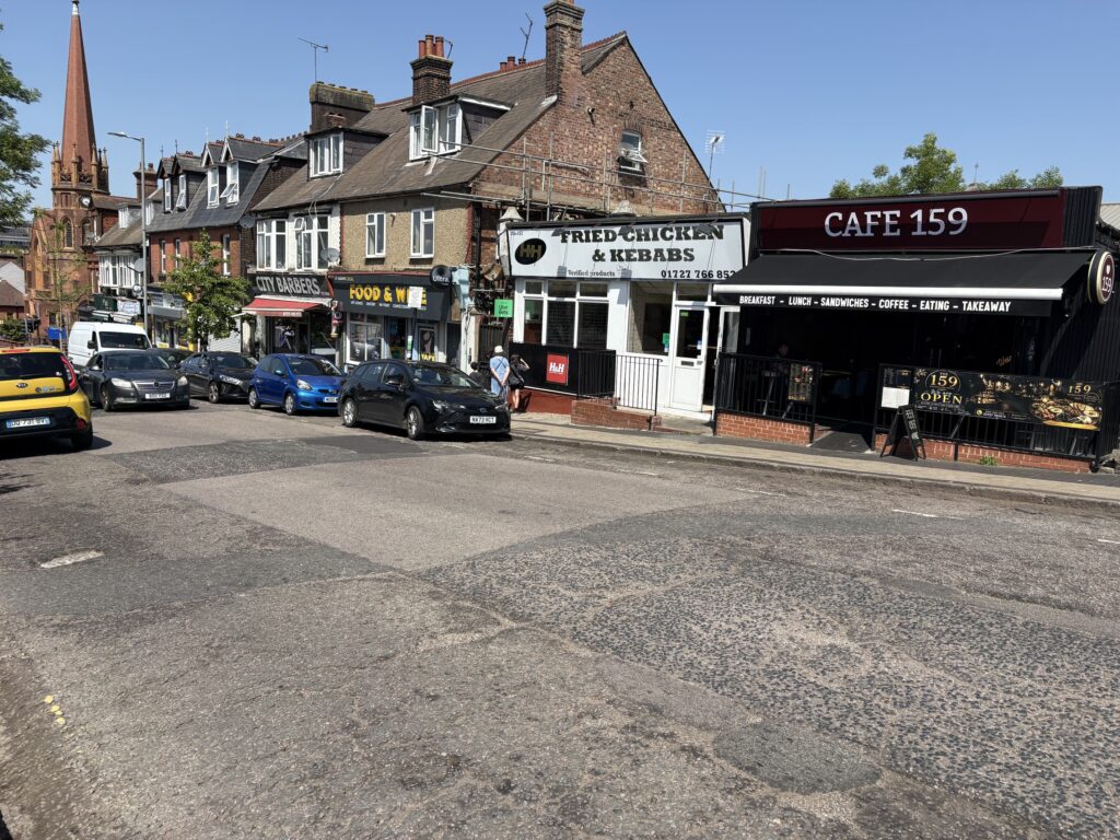 These parking bays could be removed and replaced with a cycle lane.