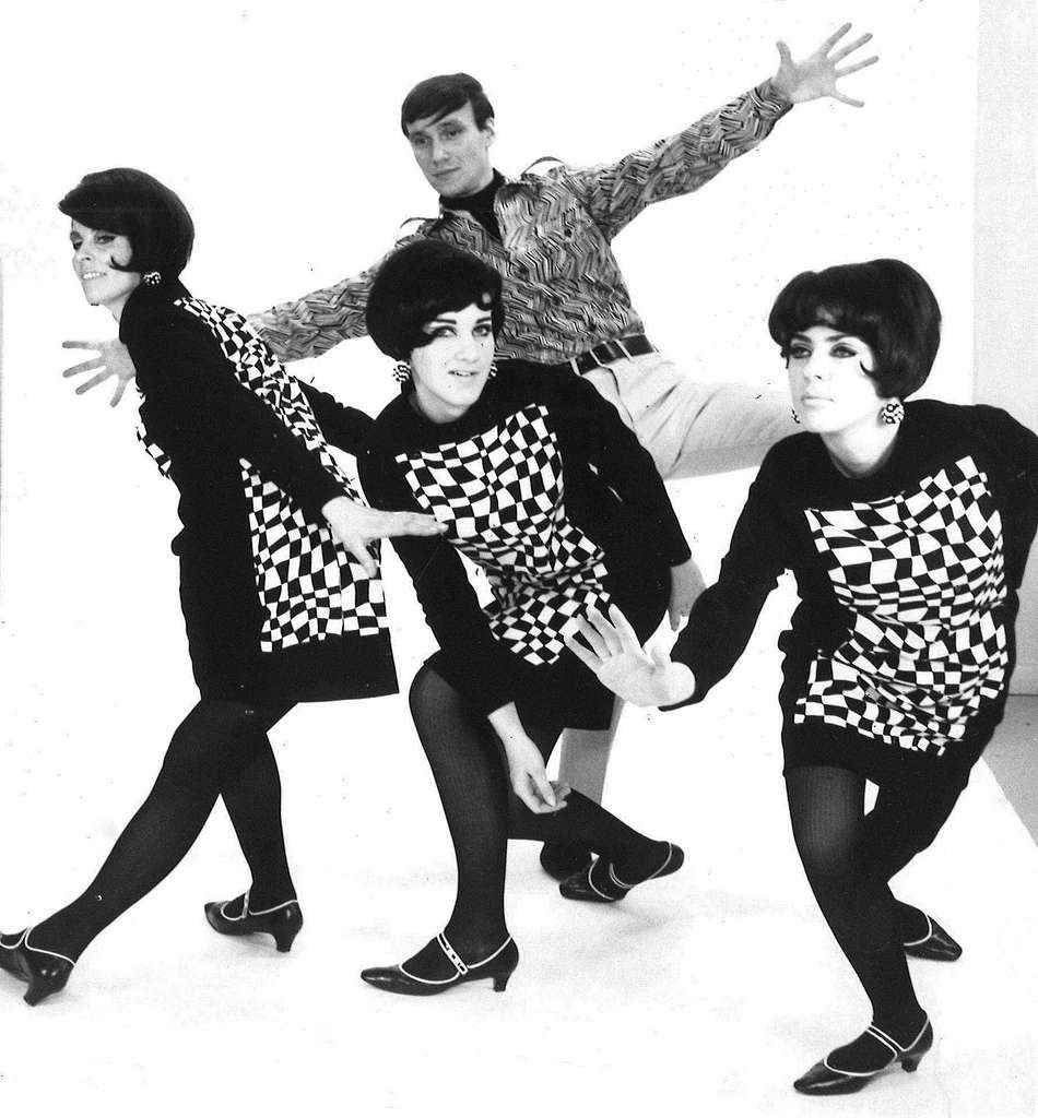 Dancers in geometric print dresses
