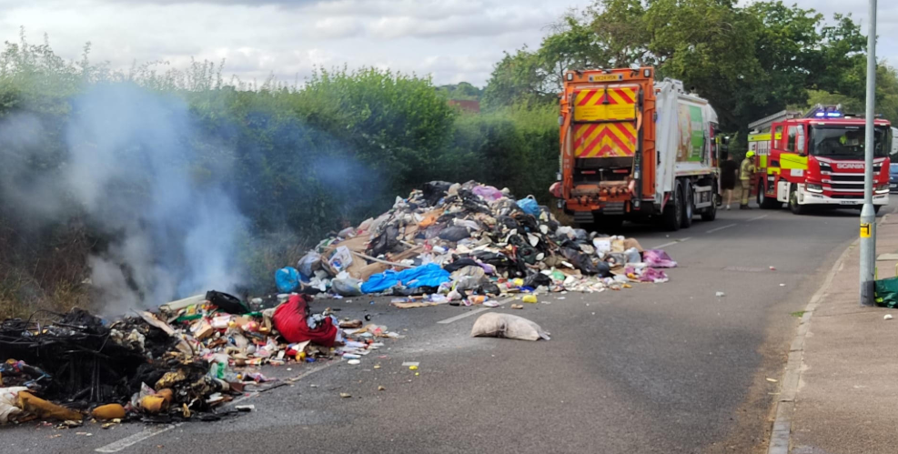 Smouldering rubbish after being ejected from a bin collection truck in Common Lane, Harpenden.